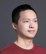 Male with black hair wearing red shirt